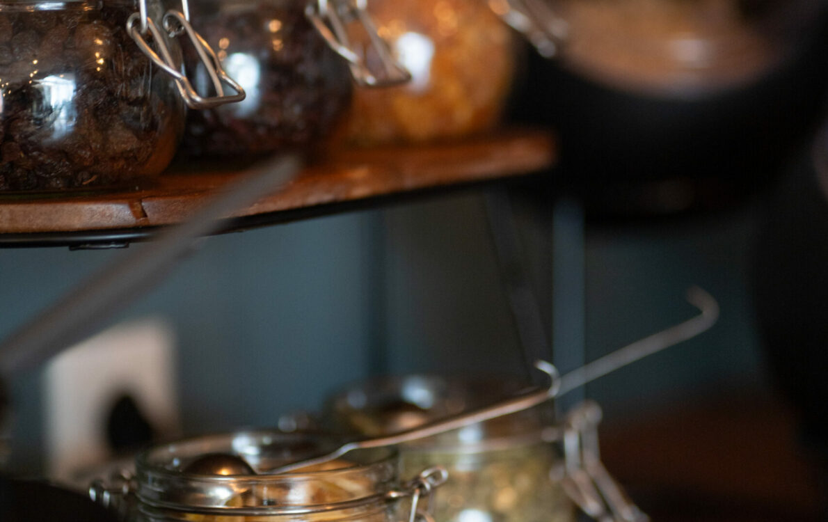 Glass jars with coffee, condiments and preserves at Hótel Breiðdalsvík breakfast table