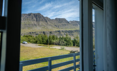 View from hotel balcony toward Icelandic mountains and green valley, Hótel Breiðdalsvík