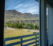 View from hotel balcony toward Icelandic mountains and green valley, Hótel Breiðdalsvík